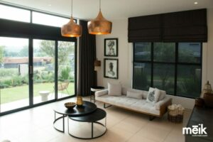 Formal lounge with large sliding doors, copper pendants and styed interior
