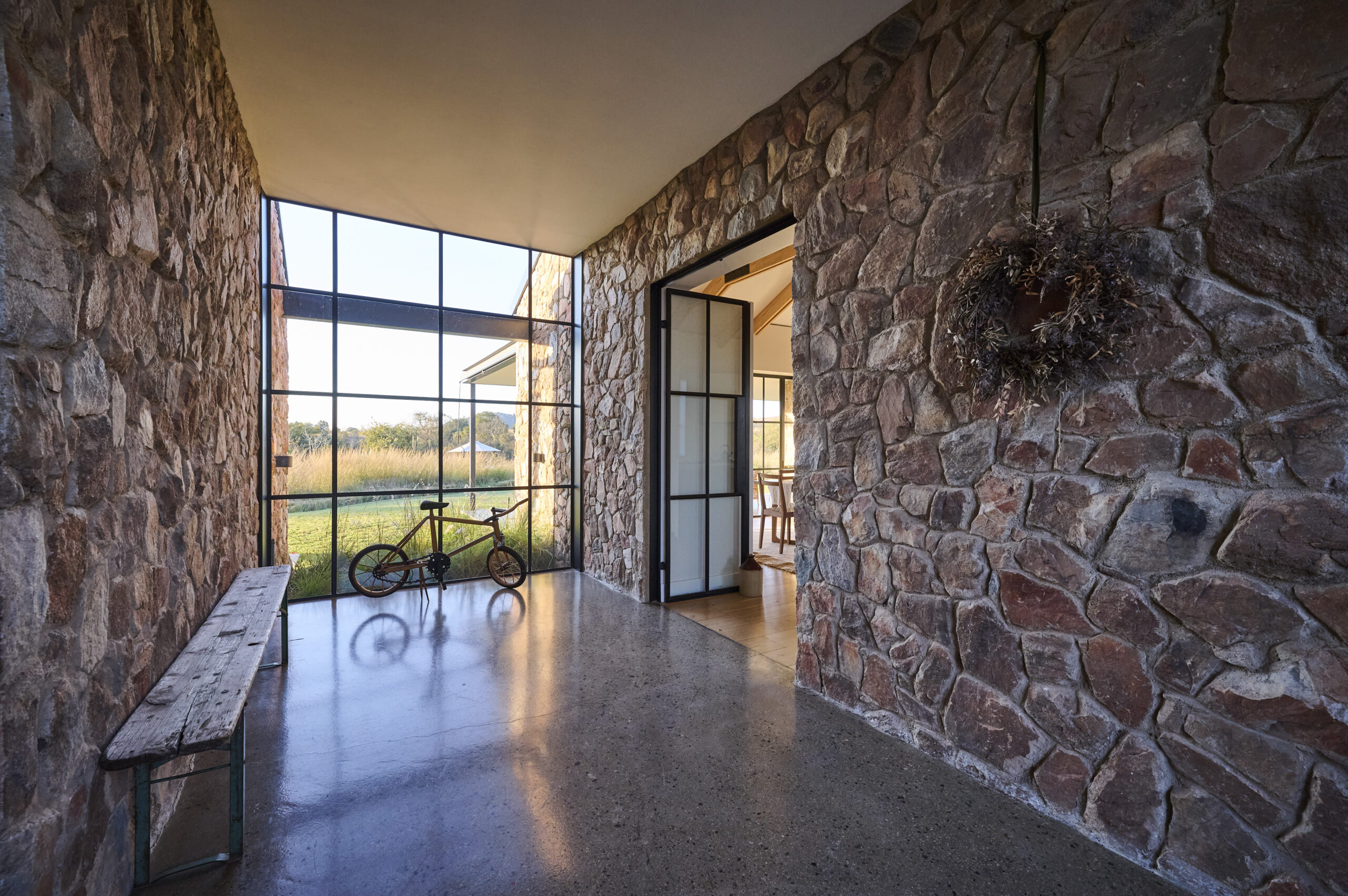 Stone House Steel-Framed Entrance Hall with outward view to Magaliesberg Mountains