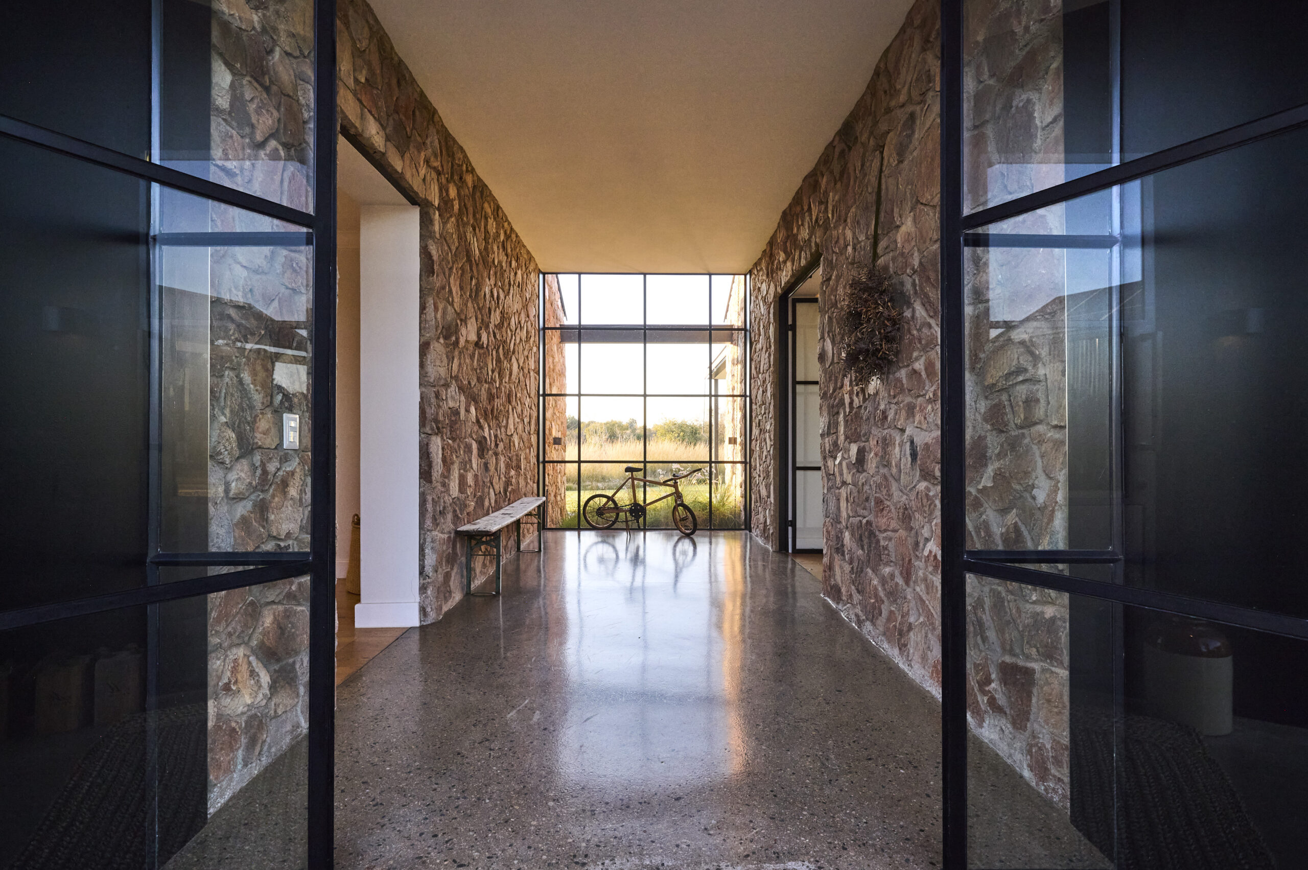 Stone House Steel-Framed Entrance Hall with outward view to Magaliesberg Mountains