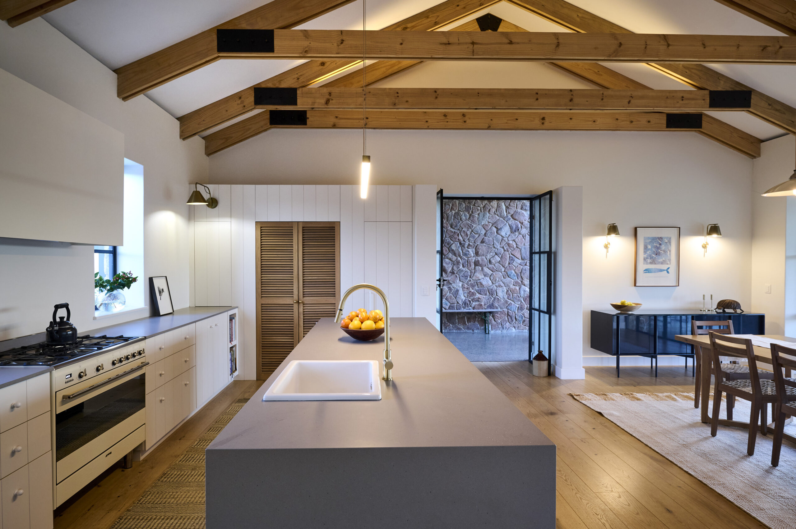 View from behind the kitchen island looking toward the open-plan dining area.