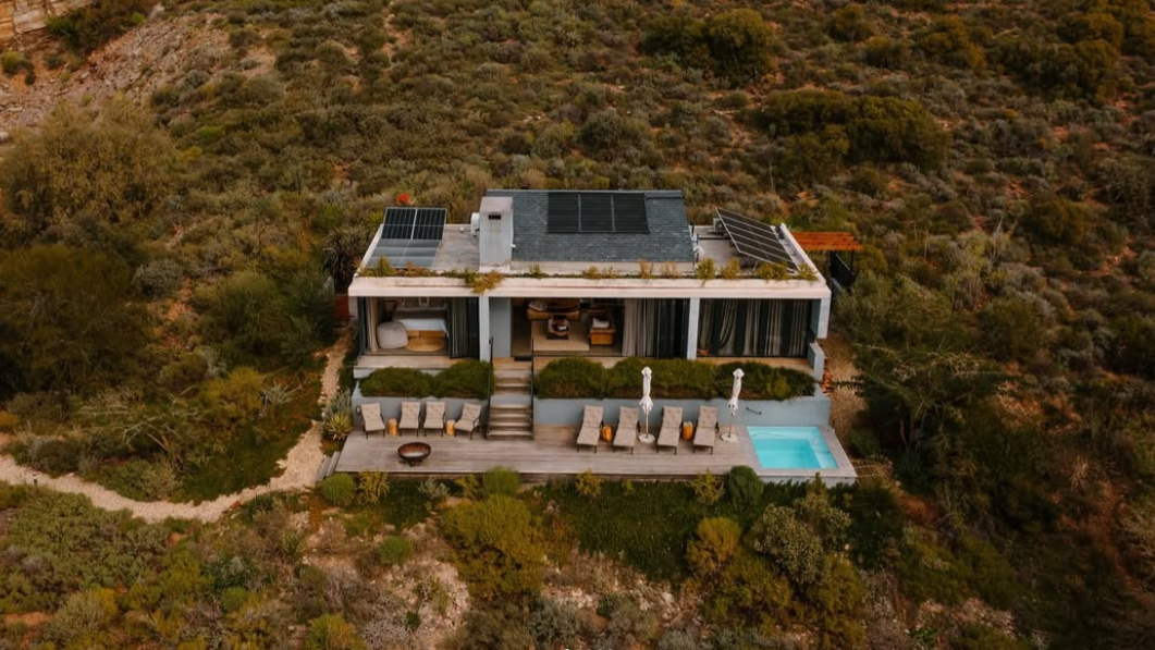 The generous deck provides an opportunity for two couples to relax poolside.