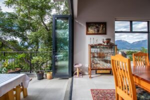 Huis Willers - First Floor Open Plan Living Space - Dining area extending onto covered patio