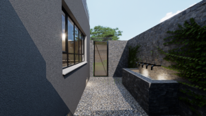 A narrow side passage with patterned stone paving, high grey walls, and a modern steel gate.