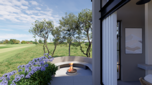 A close-up view of a circular concrete fire pit inside a sunken boma seating area surrounded by purple flowers and trees.
