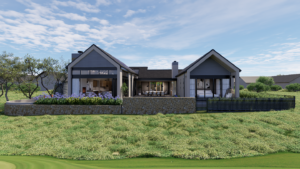 Rear elevation of a modern U-shaped home featuring symmetric gabled wings facing an open grass courtyard enclosed by a low stone wall.
